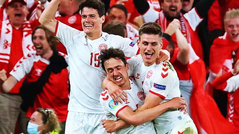 Delirious Danes reach Euro 2020 knockouts after 14 minutes of madness