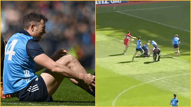 Dean Rock tries to block Shane McGuigan shot while receiving treatment from physio Dean Rock tries to block Shane McGuigan shot while receiving treatment from physio