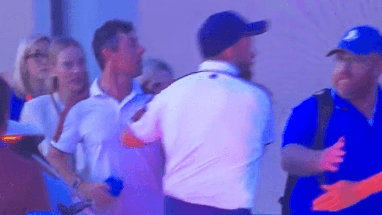 Shane Lowry forced to drag Rory McIlroy away from heated argument after 18th drama Shane Lowry forced to drag Rory McIlroy away from heated argument after 18th drama
