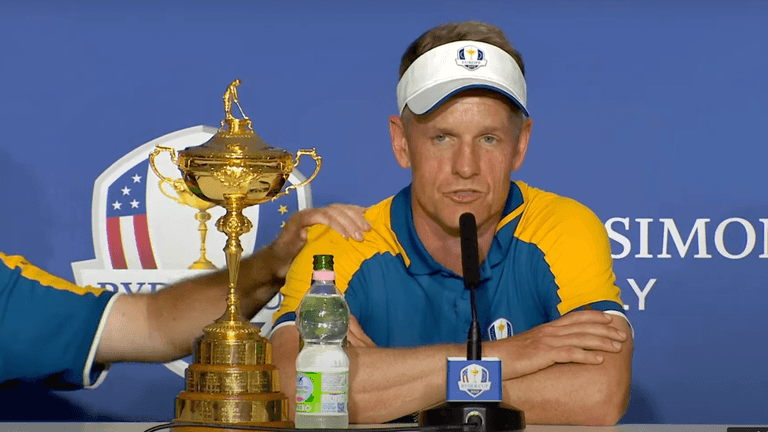 Shane Lowry comforts Luke Donald as he speaks about his late parents Shane Lowry comforts Luke Donald as he speaks about his late parents