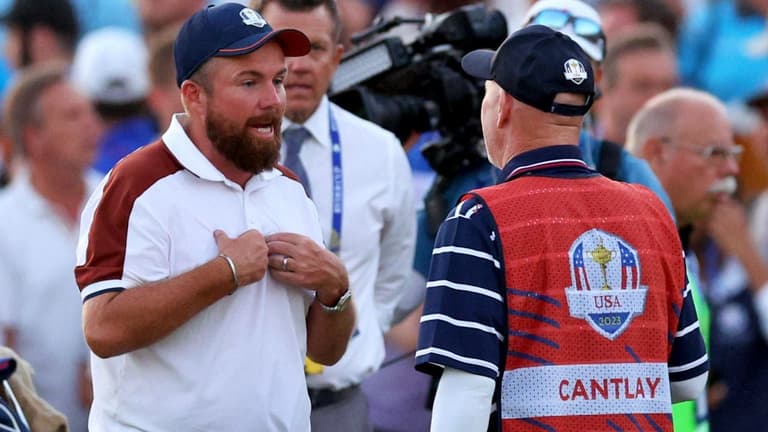 Shane Lowry in 18th green altercation with Team USA caddie after fraught finish Shane Lowry in 18th green altercation with Team USA caddie after fraught finish