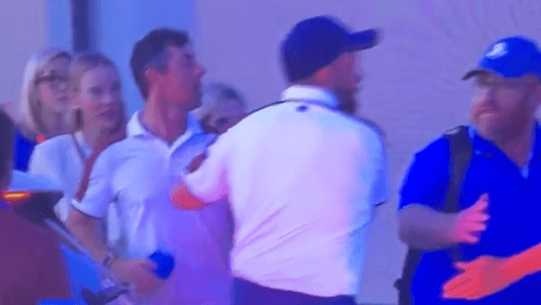 Shane Lowry forced to drag Rory McIlroy away from heated argument after 18th drama Shane Lowry forced to drag Rory McIlroy away from heated argument after 18th drama