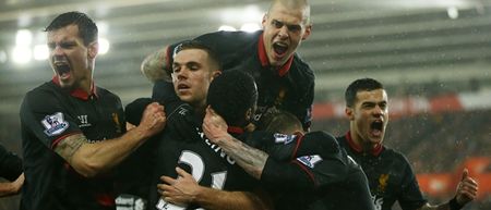 PIC: Liverpool players celebrate Raheem Sterling’s goal as if there’s not a pitch invader being tackled