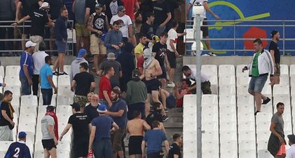 Pic: A father pleads with rioters to allow him and his son to leave the Stade Velodrome